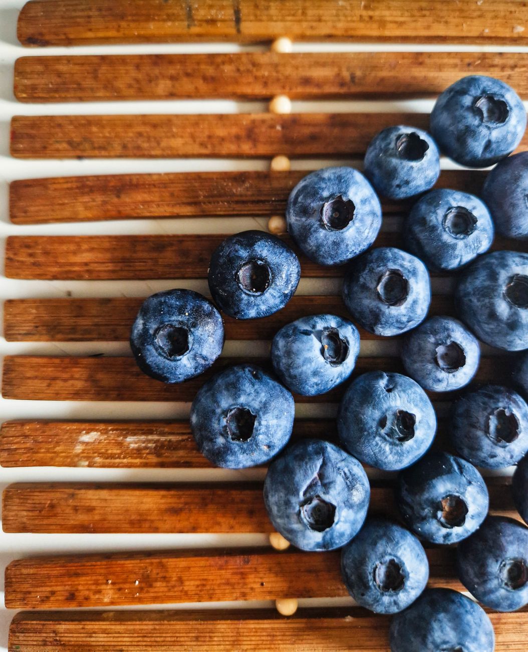 Blueberries arranged on wooden slats