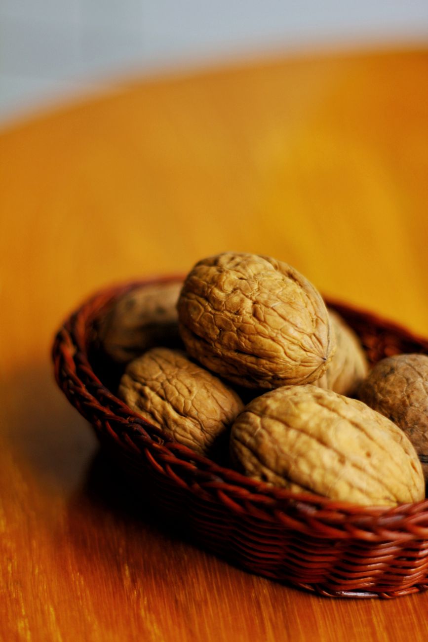 Basket of whole walnuts in shell